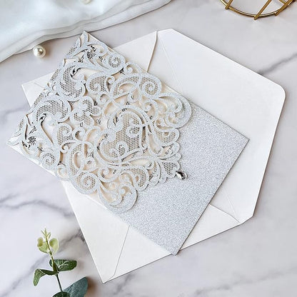 Hosmsua 5.1 x 7.3 Inch 50PCS Silver Glitter Wedding Invitation Cards with Rhinestone Laser Cut Hollow Flora Quinceanera Invitation with Envelopes for Bridal Shower Wedding Invite (Silver Glitter)